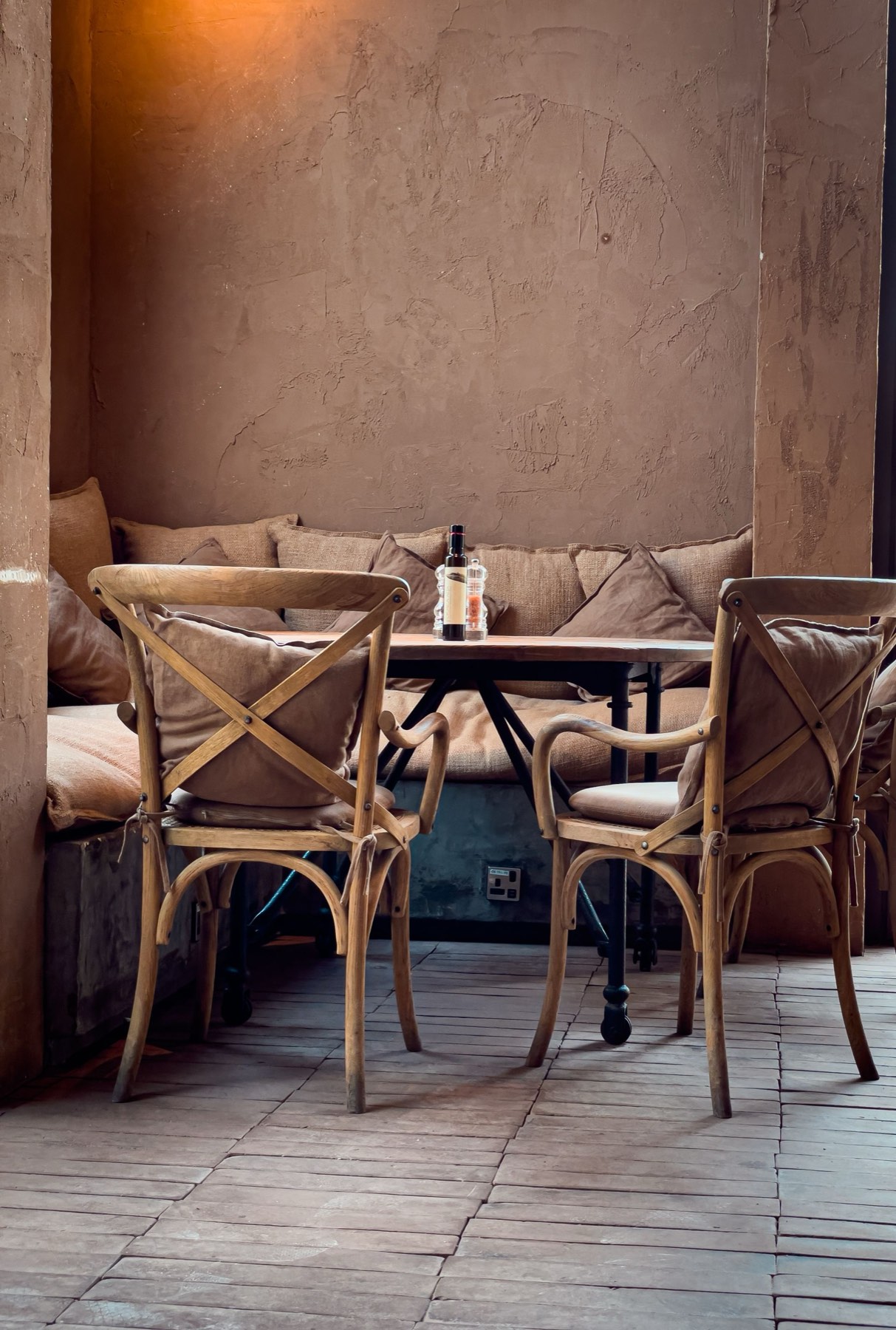 A cosy restaurant corner set for dinner
